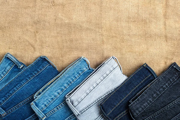 depositphotos_545590486-stock-photo-jeans-different-shades-lie-background